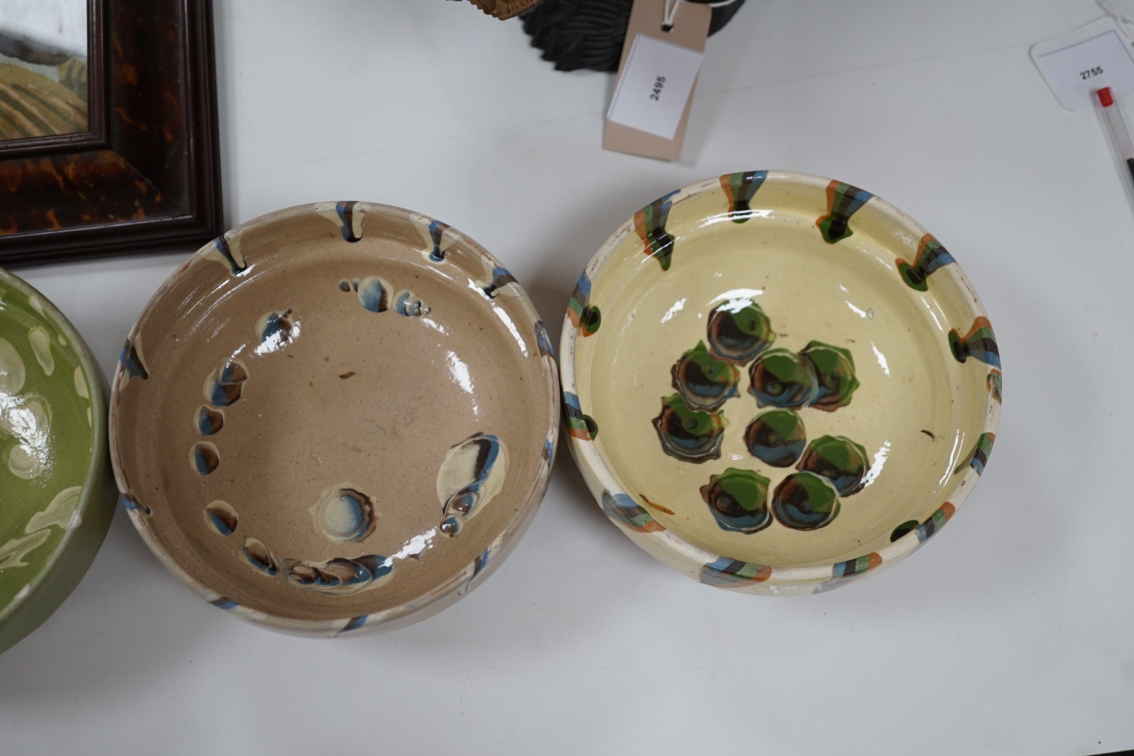 A group of six continental pottery slip decorated bowls, 16 cms diameter